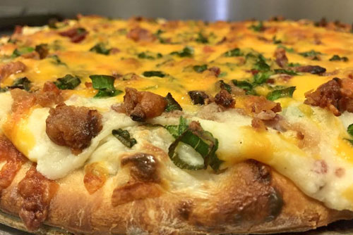 $2 OFF 14" Pizza With 2 Or More Toppings at EJ's Pizzeria